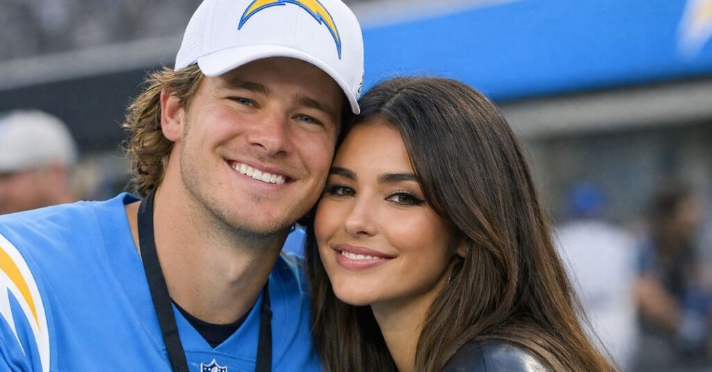 Madison Beer and Justin Herbert appear together in a candid moment during a Los Angeles Chargers game, highlighting the singer and NFL quarterback following Herbert’s birthday tribute to Madison Beer.